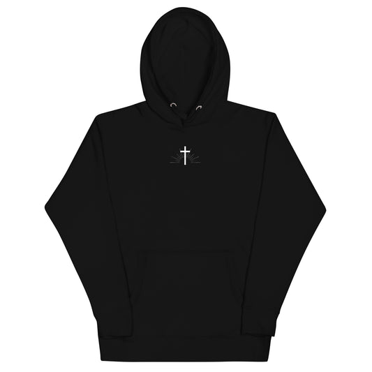 sunrise behind a cross hoodie